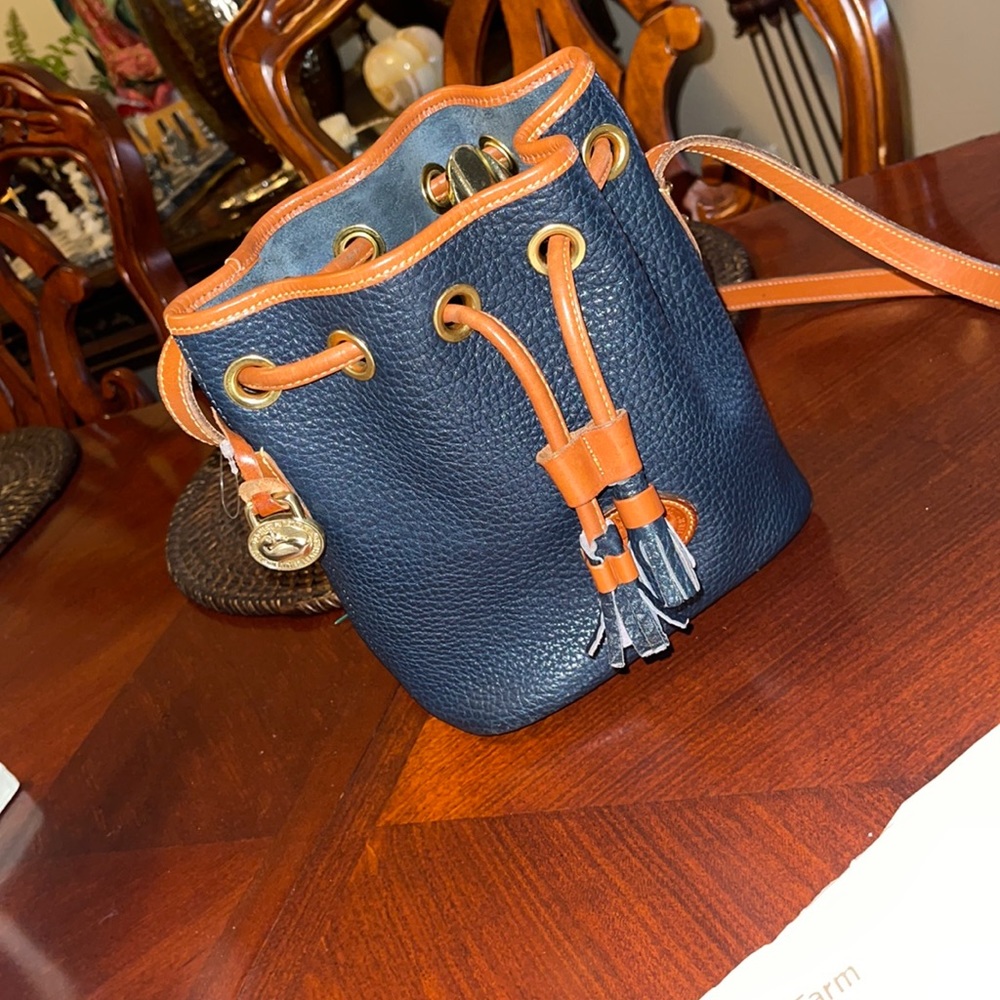 Dooney & Bourke Navy and Tan Pebbled Leather Drawstring Crossbody
